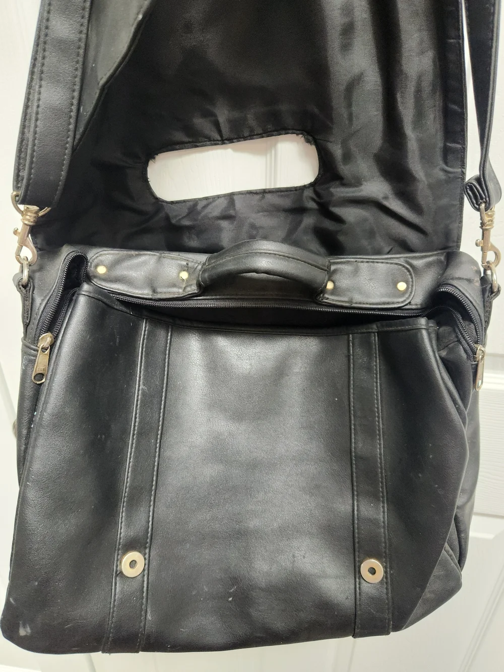 Black Leather Messenger Bag with Top Handle and Adjustable Shoulder Strap